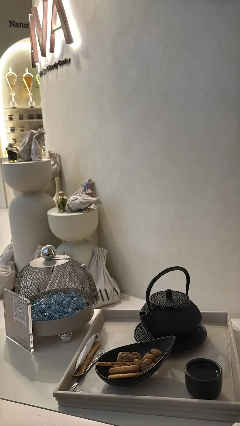 A tea tray with a cast-iron teapot and biscuits at AVA's reception